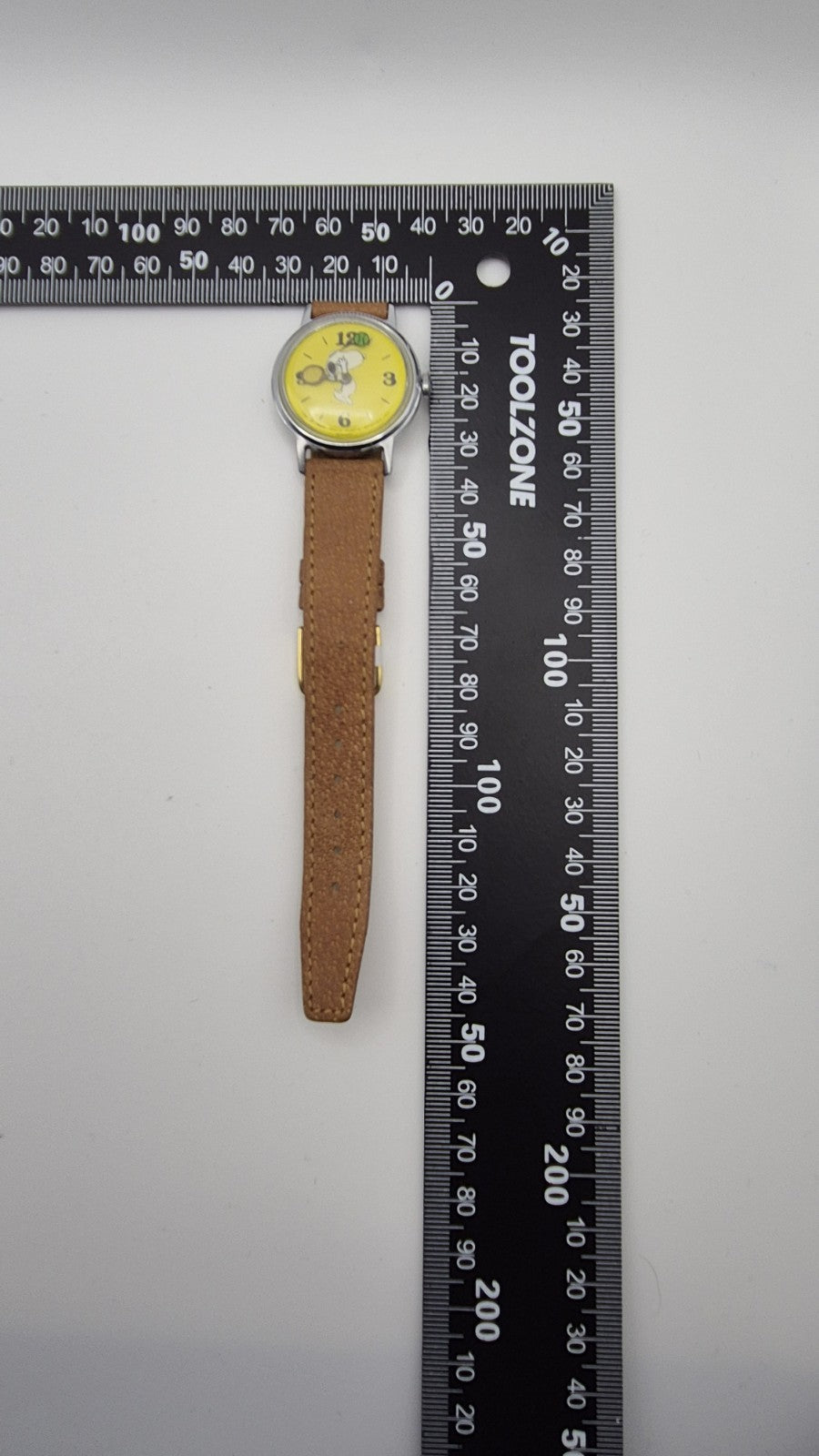 Vintage Timex Snoopy "Tennis" watch features a yellow dial with a mechanical...15
