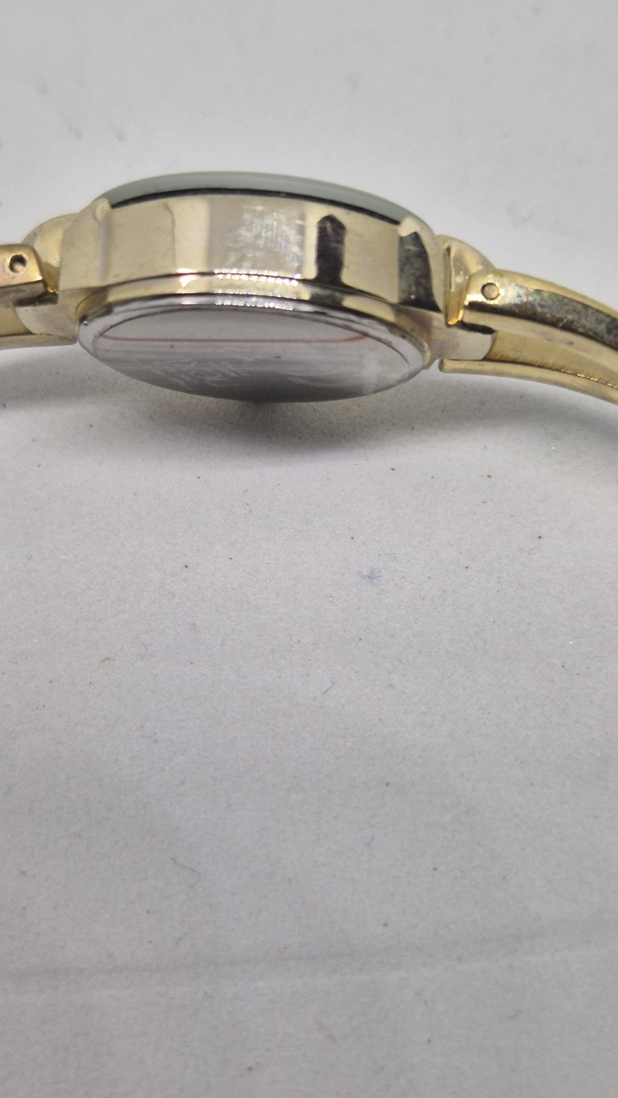 Next women's watch with a goldtone band and a crystalembellished case6