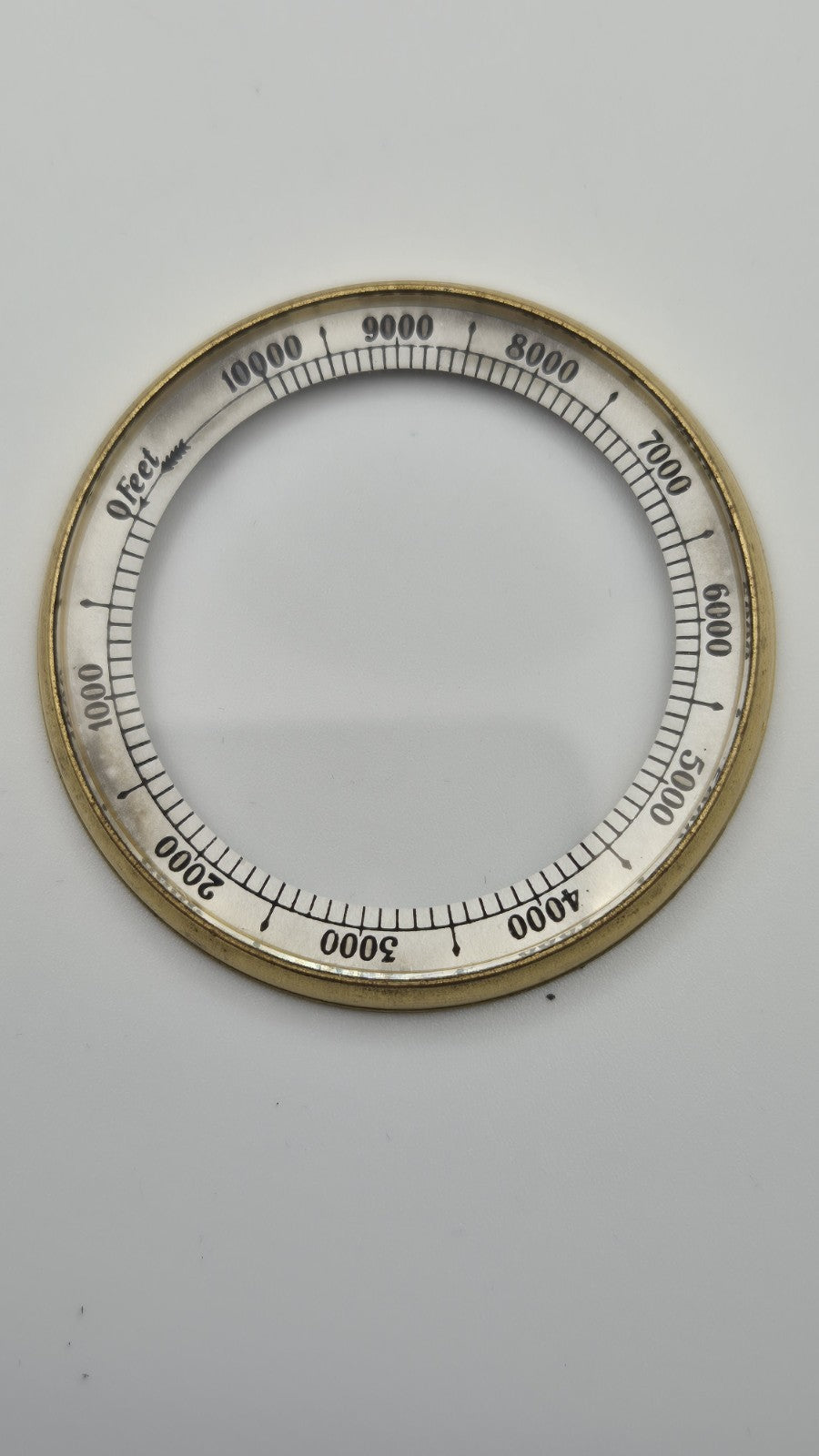 Antique pocket barometer with an altimeter scale in a brass case.12