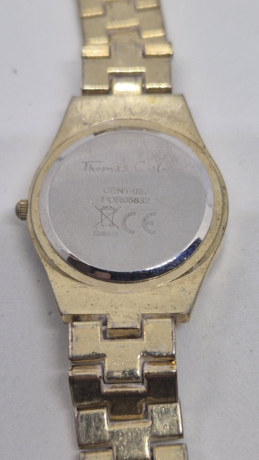Thomas Calvi analog quartz wristwatch with a goldtoned band and a...10