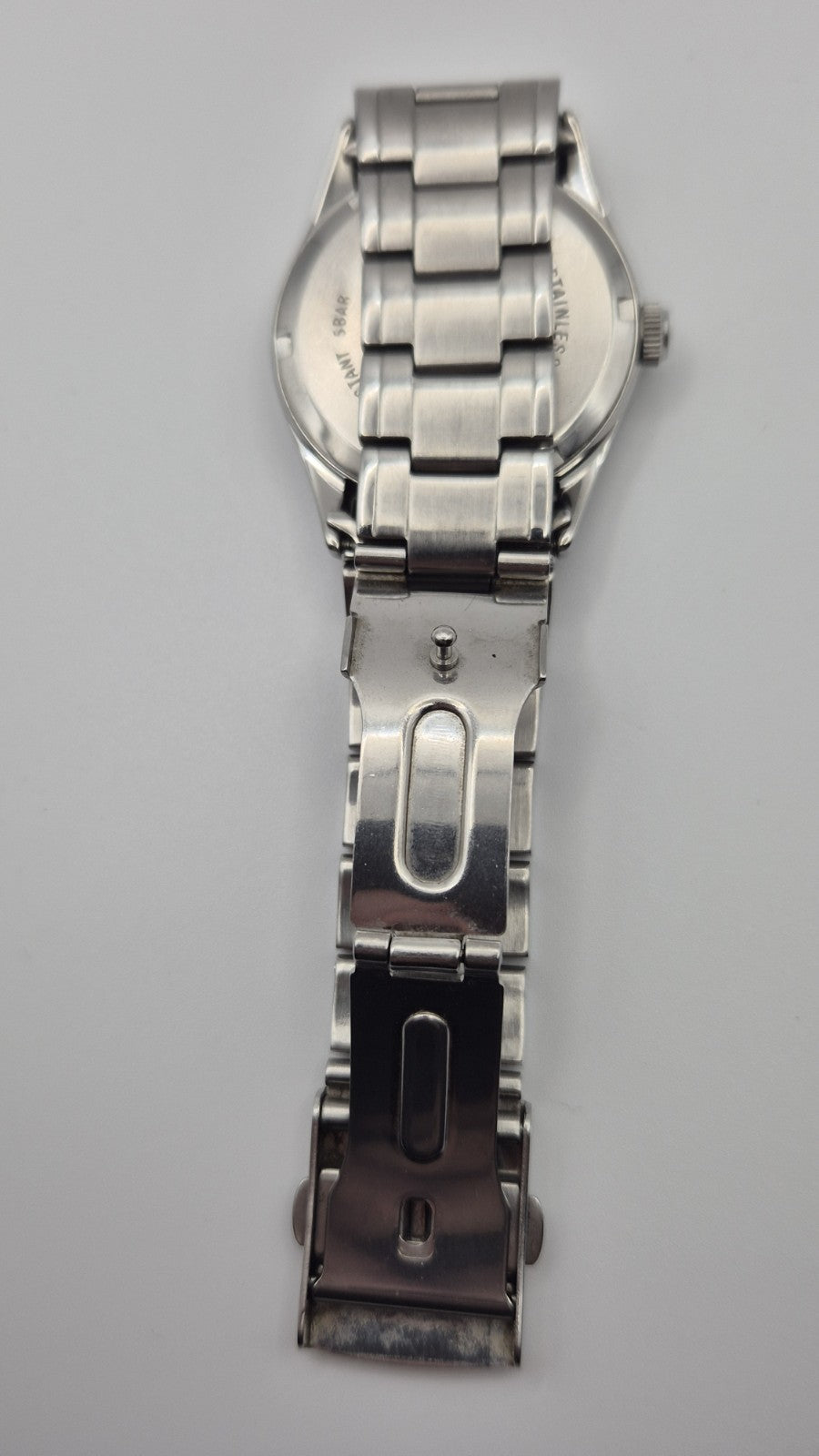 Casio MTP1181 watch with a black dial and stainless steel band7