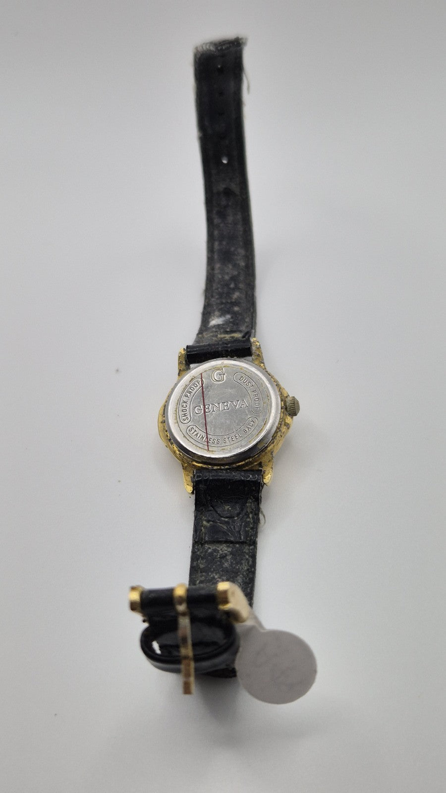 Geneva women's quartz watch with a green dial and goldtone case.7