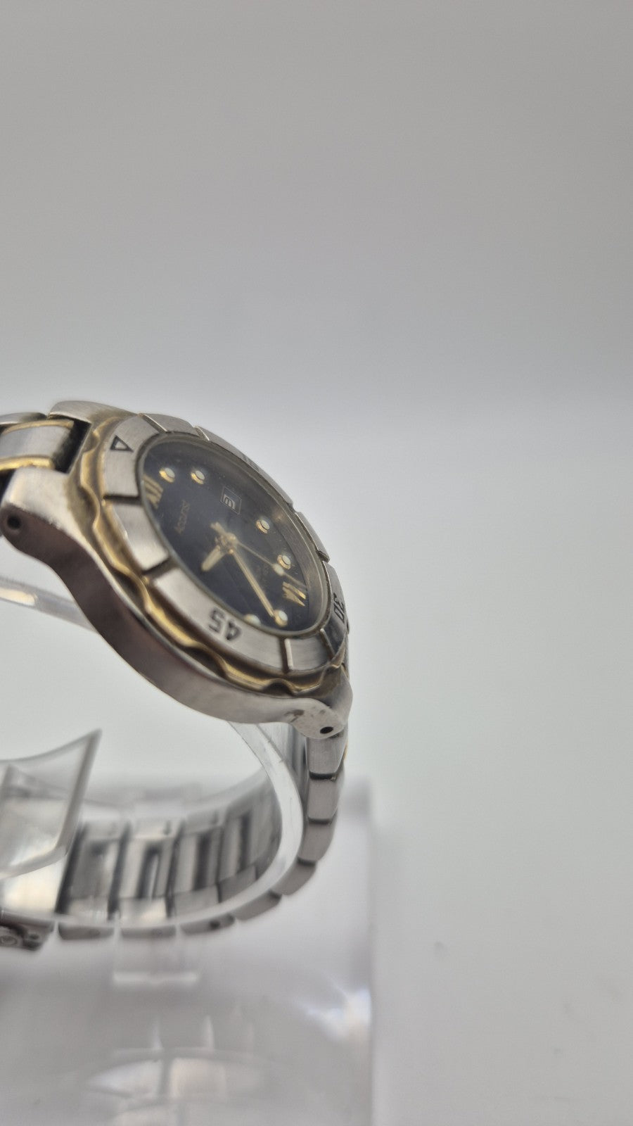 Accurist watch with a blue dial and two-tone bracelet.4