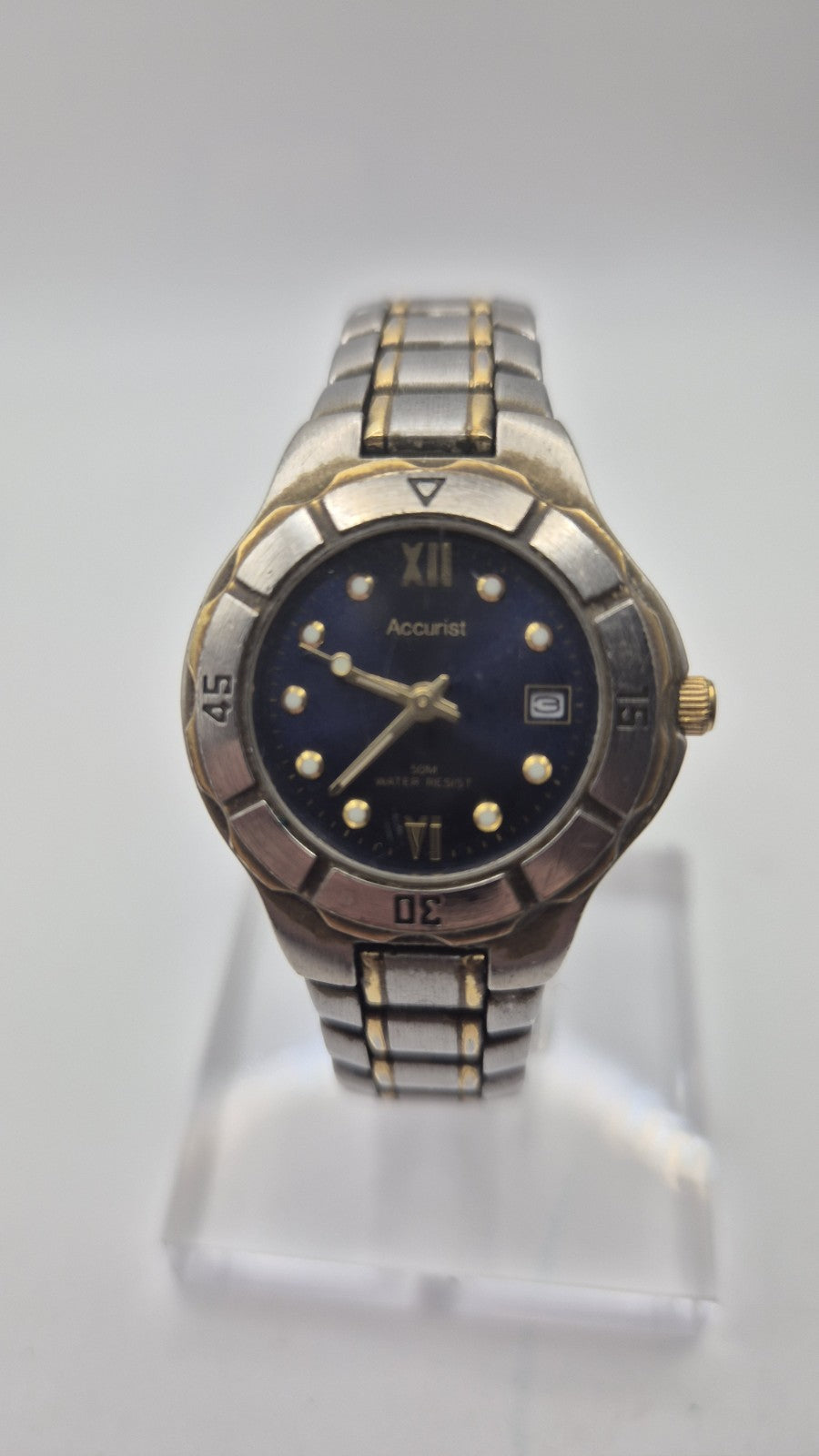 Accurist watch with a blue dial and two-tone bracelet.8