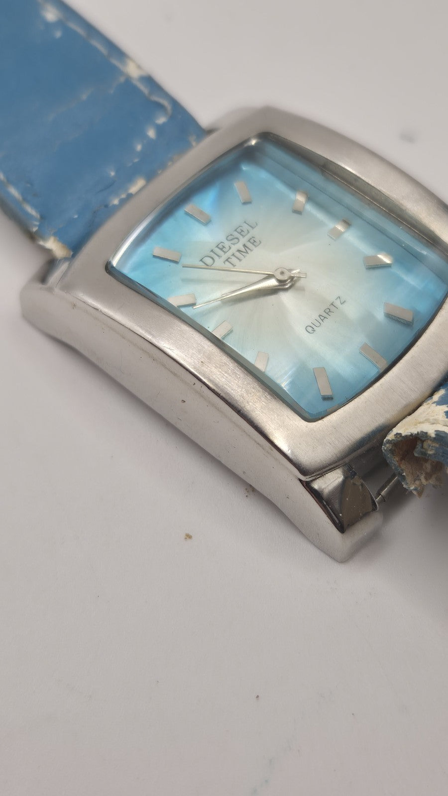 Diesel wristwatch features a rectangular stainless steel case and a blue dial...10
