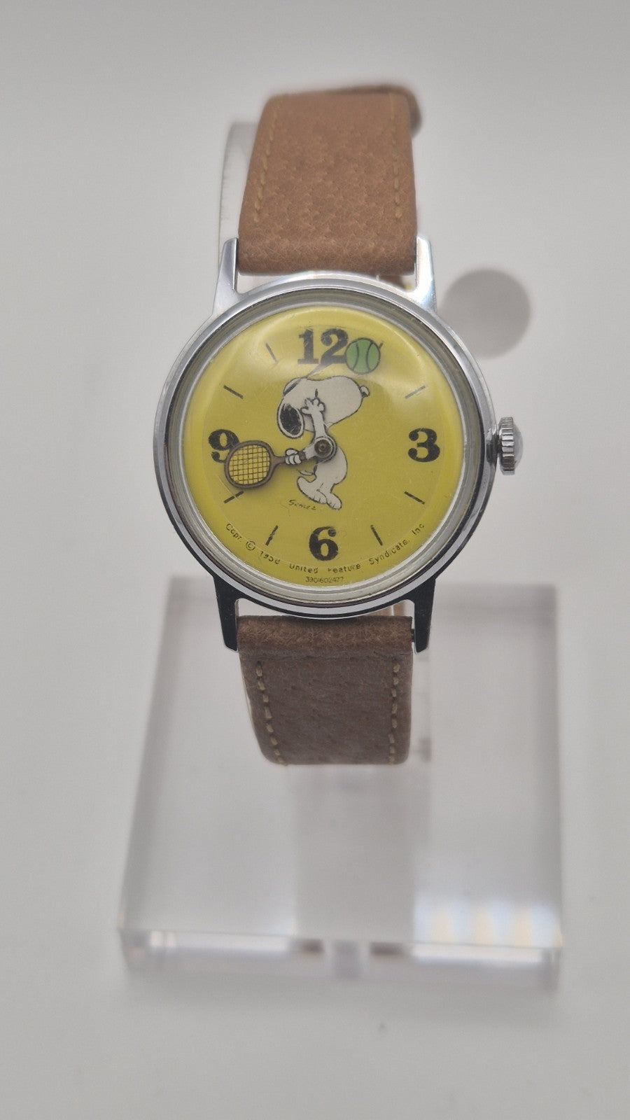 Vintage Timex Snoopy "Tennis" watch features a yellow dial with a mechanical...1