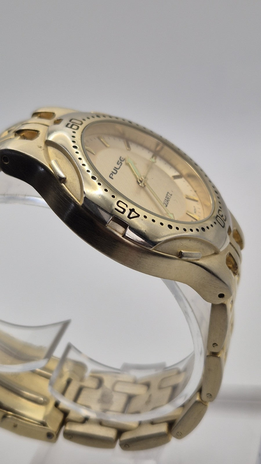 gold-toned Pulse brand watch4