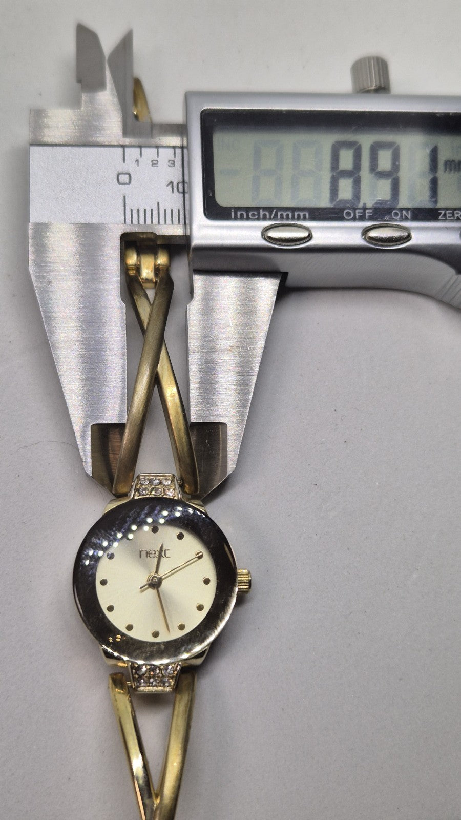 Next women's watch with a goldtone band and a crystalembellished case15