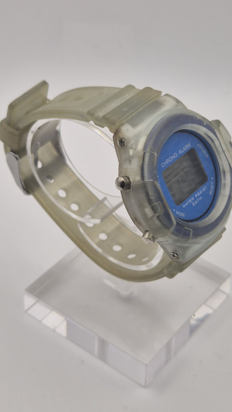 digital watch featuring a blue face and a transparent plastic strap2