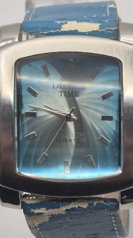 Diesel wristwatch features a rectangular stainless steel case and a blue dial...0