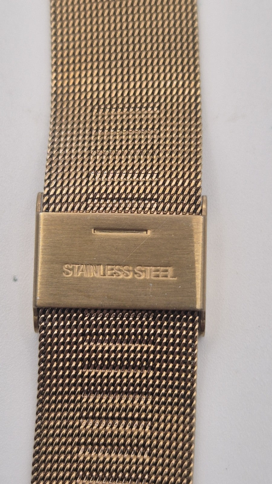 Phasar Quartz digital watch features a gold-tone metal case with wear on the...10