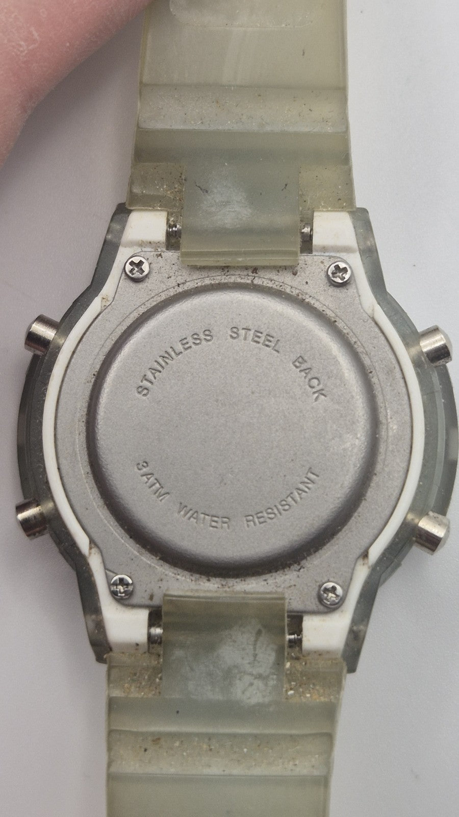 digital watch featuring a blue face and a transparent plastic strap9