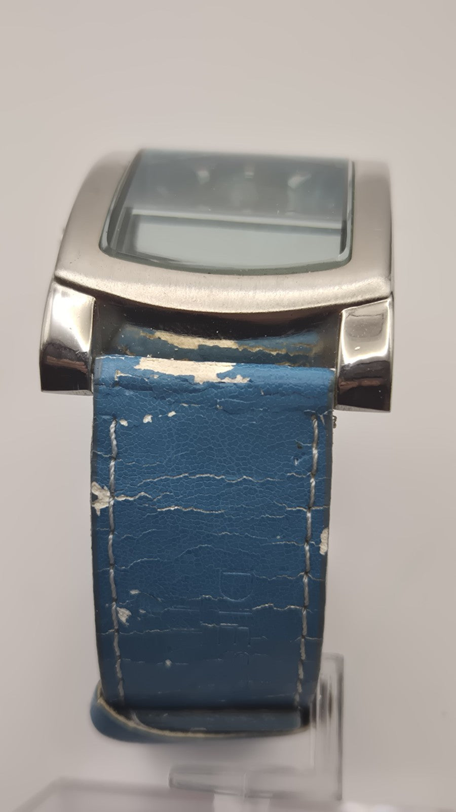 Diesel wristwatch features a rectangular stainless steel case and a blue dial...7