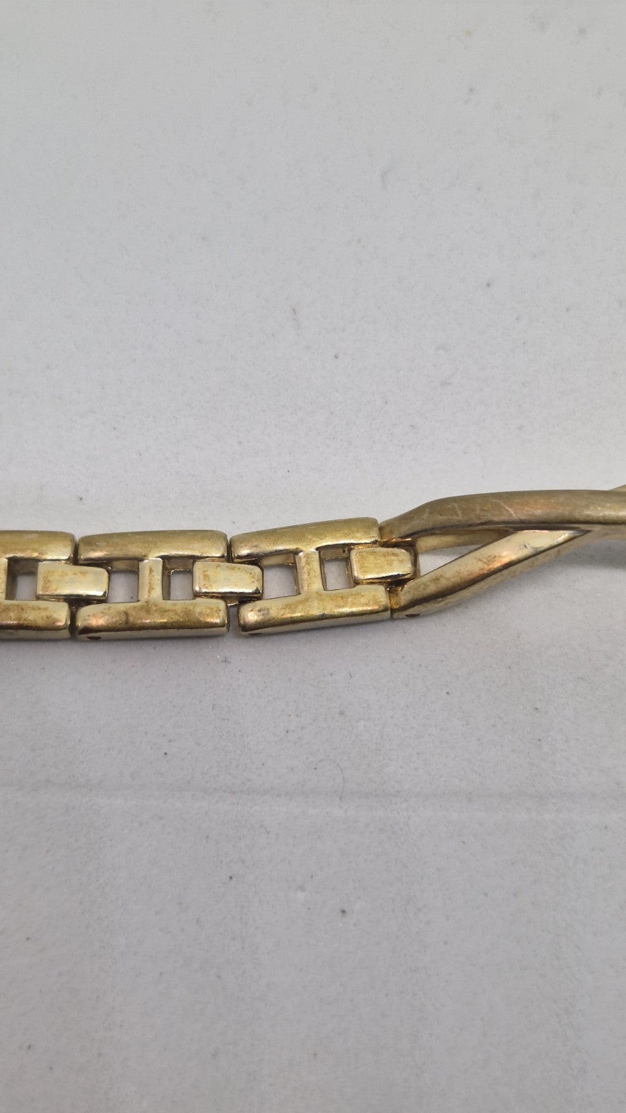 Next women's watch with a goldtone band and a crystalembellished case14