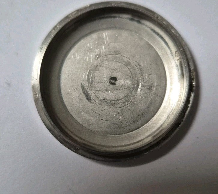 Vintage stainless steel case back from a Seiko 6139-7002 watch1