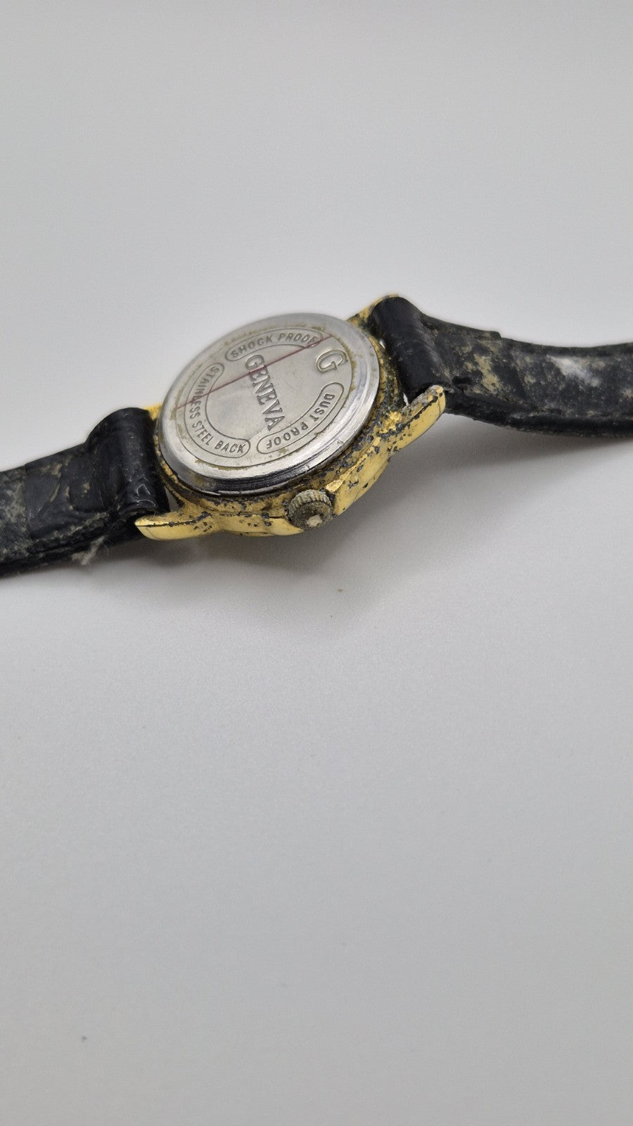 Geneva women's quartz watch with a green dial and goldtone case.6
