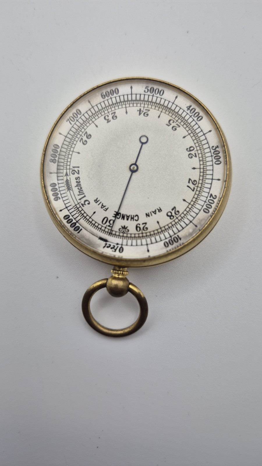Antique pocket barometer with an altimeter scale in a brass case.3