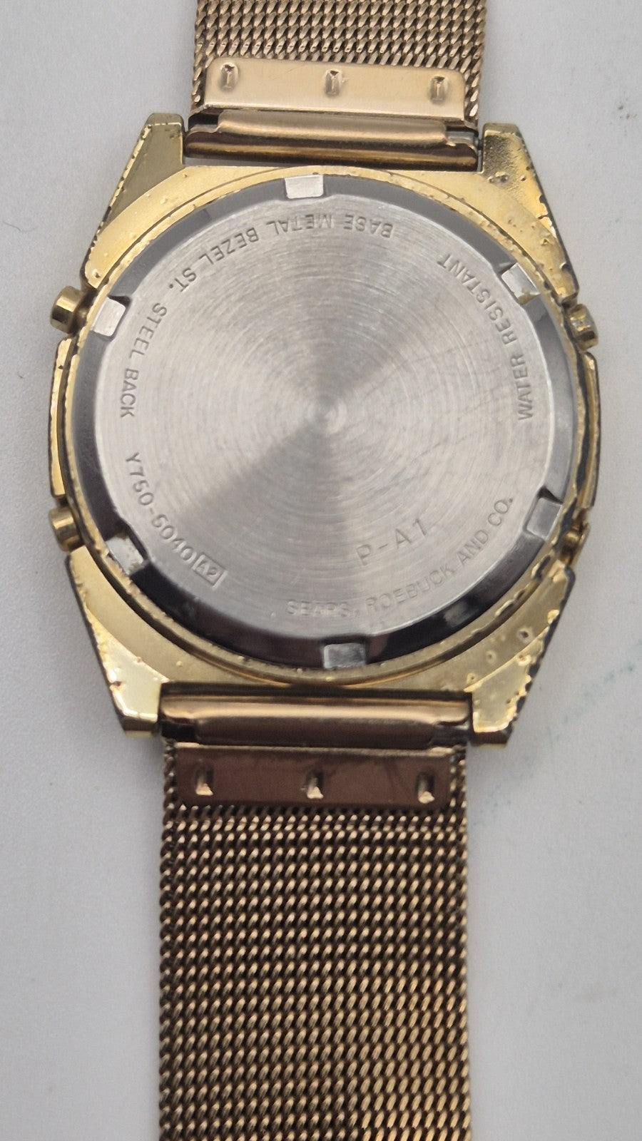 Phasar Quartz digital watch features a gold-tone metal case with wear on the...5