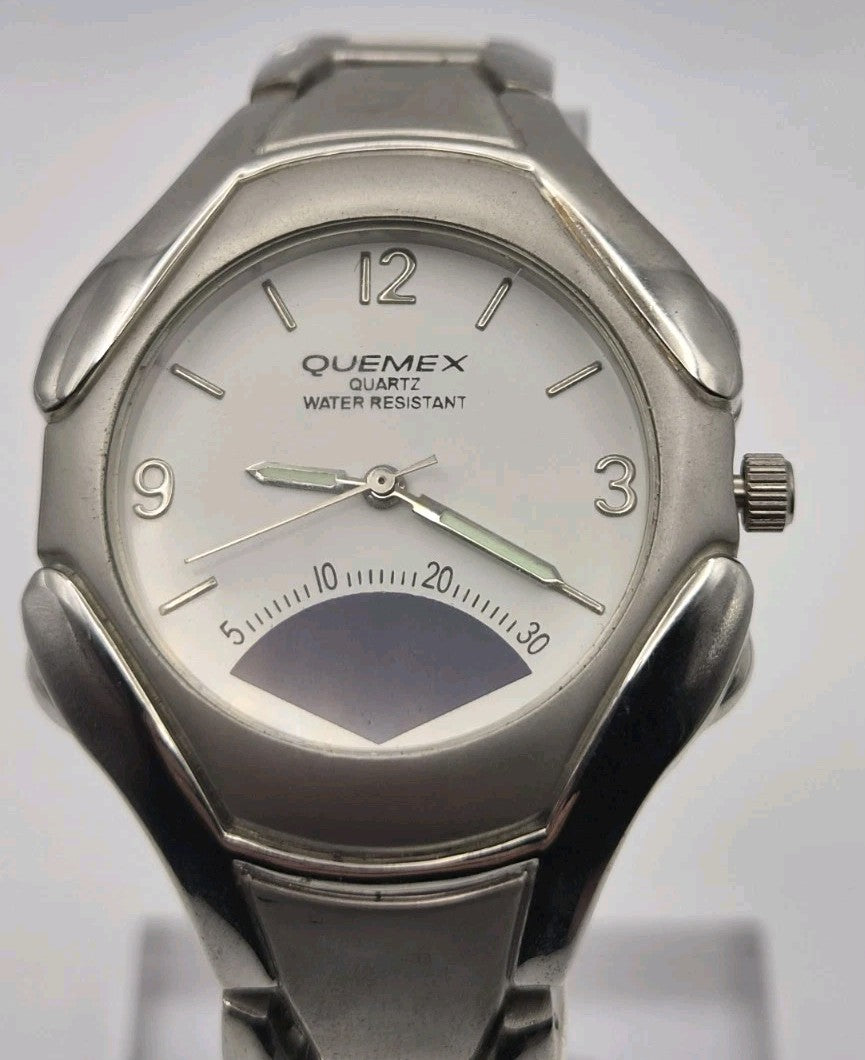 Mens Quemex quartz wristwatch with a silver-tone stainless steel case and...0