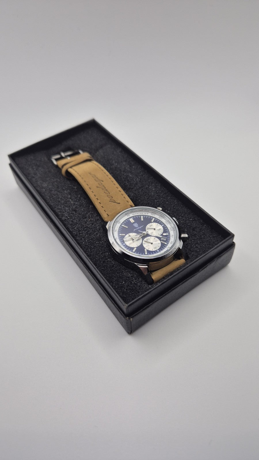 Poedagar men's luxury quartz chronograph watch with a blue dial and a tan...3