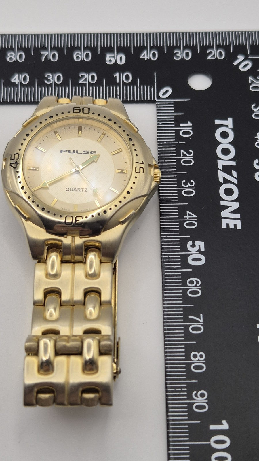 gold-toned Pulse brand watch21