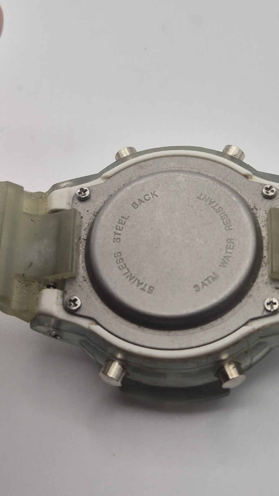 digital watch featuring a blue face and a transparent plastic strap11