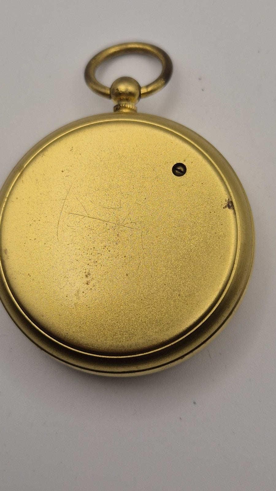 Antique pocket barometer with an altimeter scale in a brass case.21