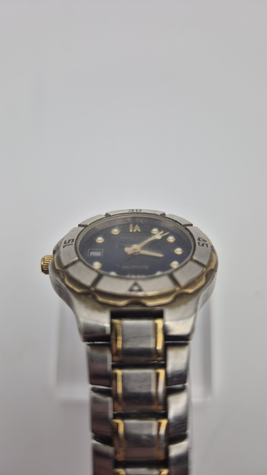 Accurist watch with a blue dial and two-tone bracelet.6