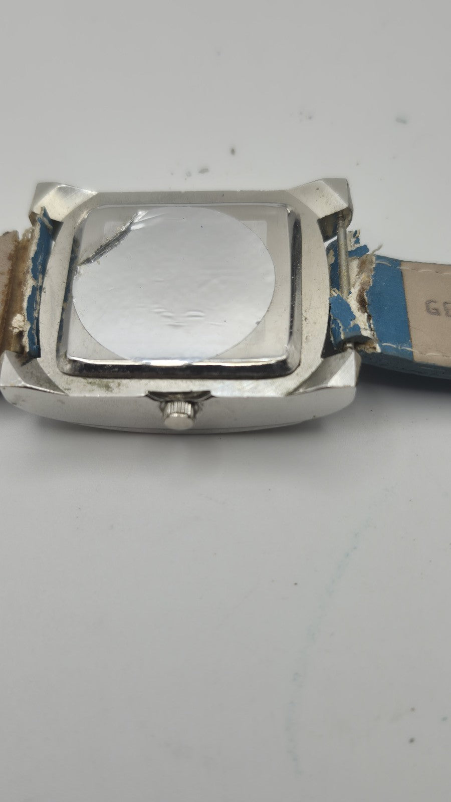 Diesel wristwatch features a rectangular stainless steel case and a blue dial...13