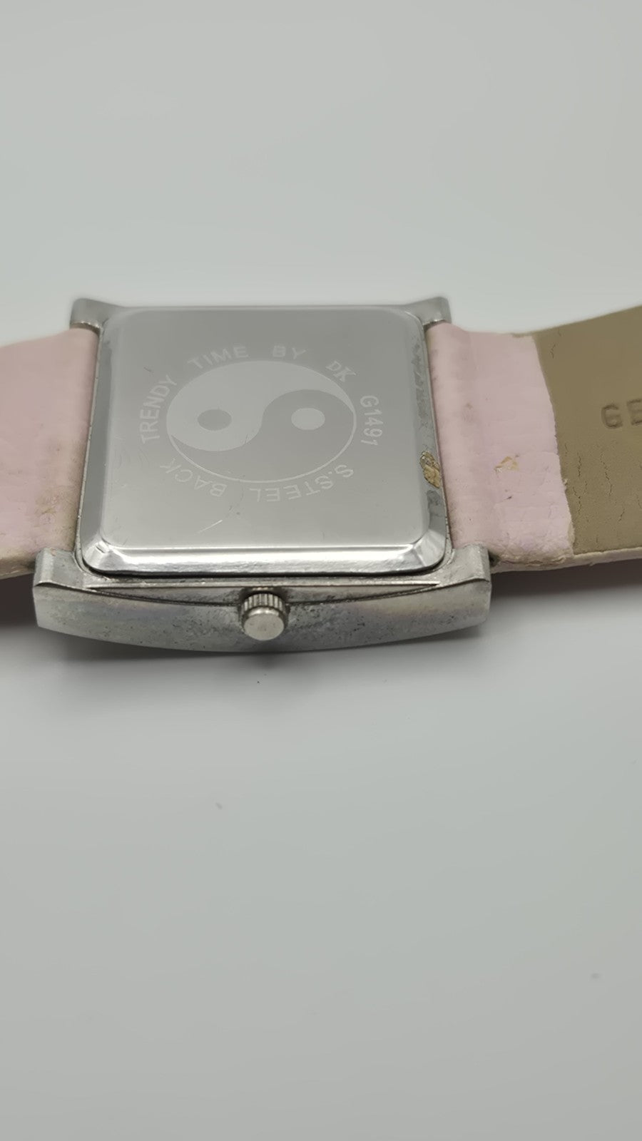 D&G Time squarefaced analog watch with a light pink leather strap and...10
