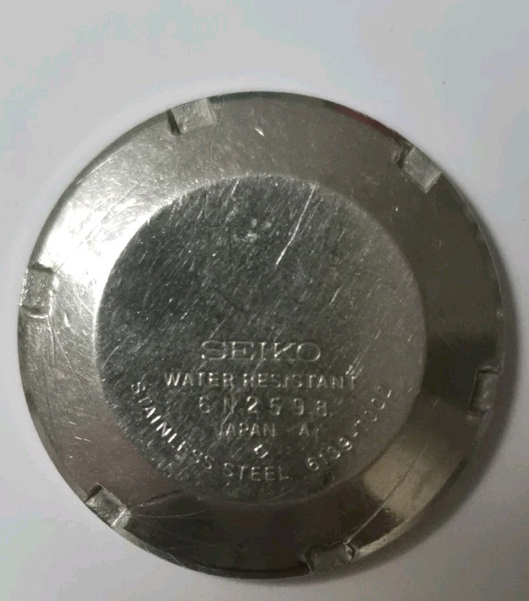 Vintage stainless steel case back from a Seiko 6139-7002 watch2