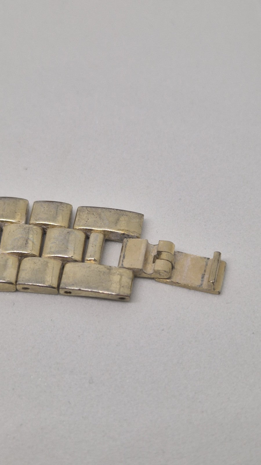 Thomas Calvi analog quartz wristwatch with a goldtoned band and a...7