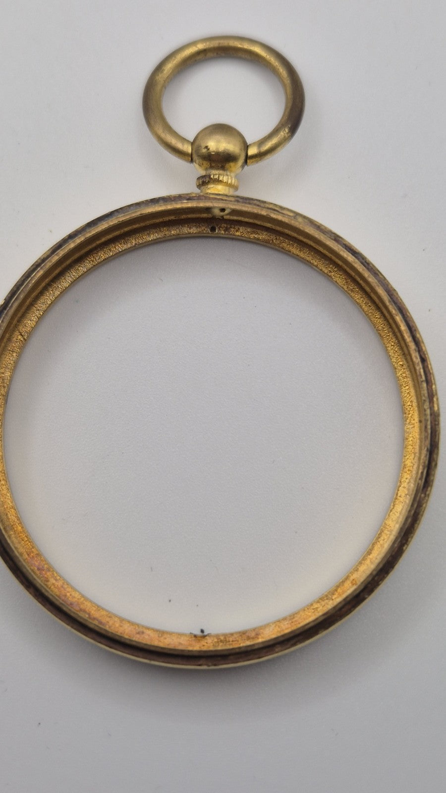 Antique pocket barometer with an altimeter scale in a brass case.9