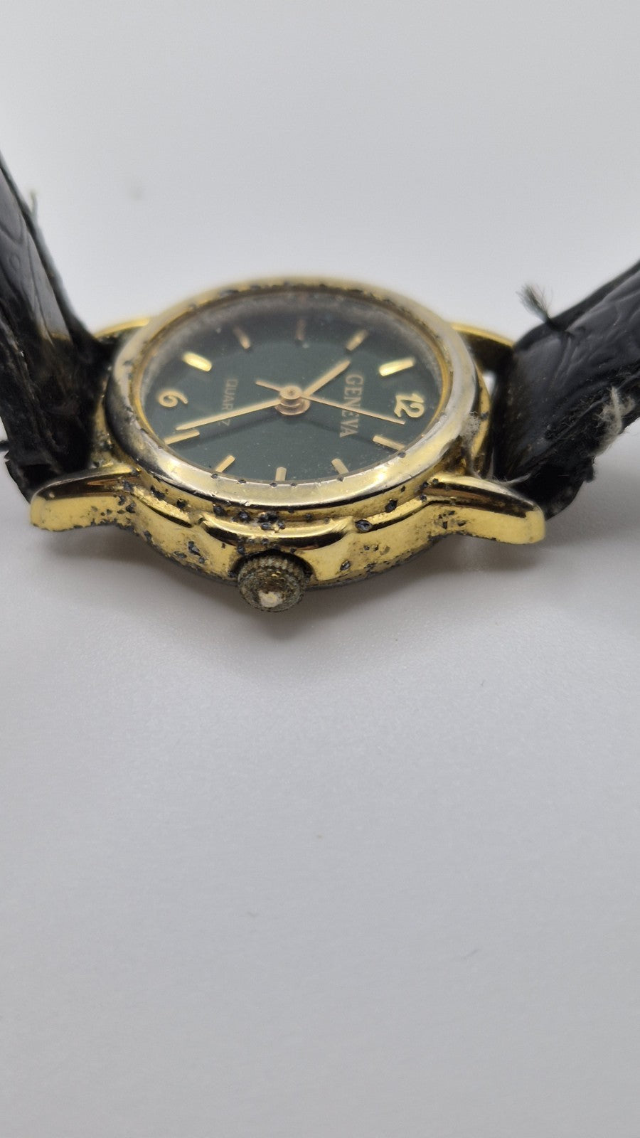 Geneva women's quartz watch with a green dial and goldtone case.2