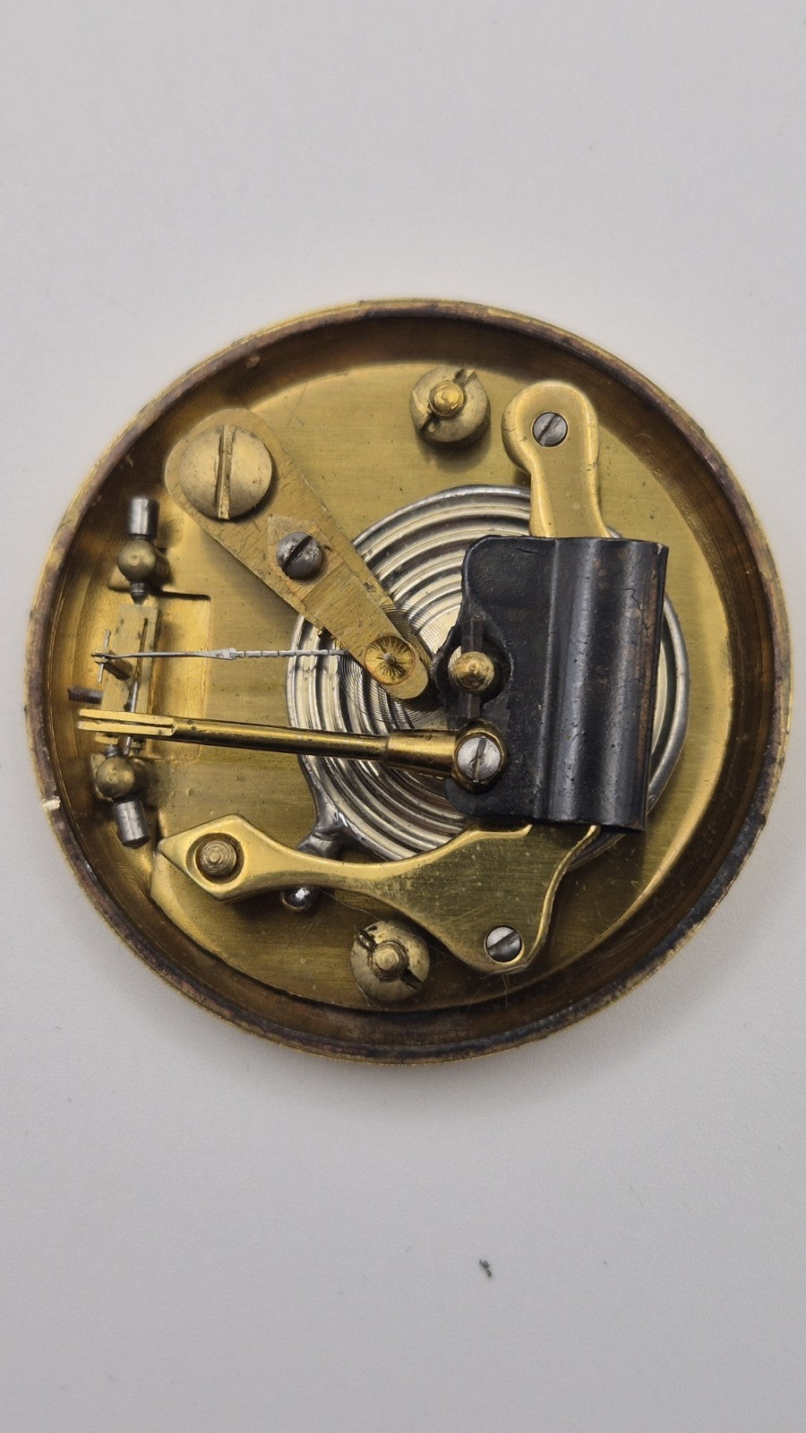 Antique pocket barometer with an altimeter scale in a brass case.7