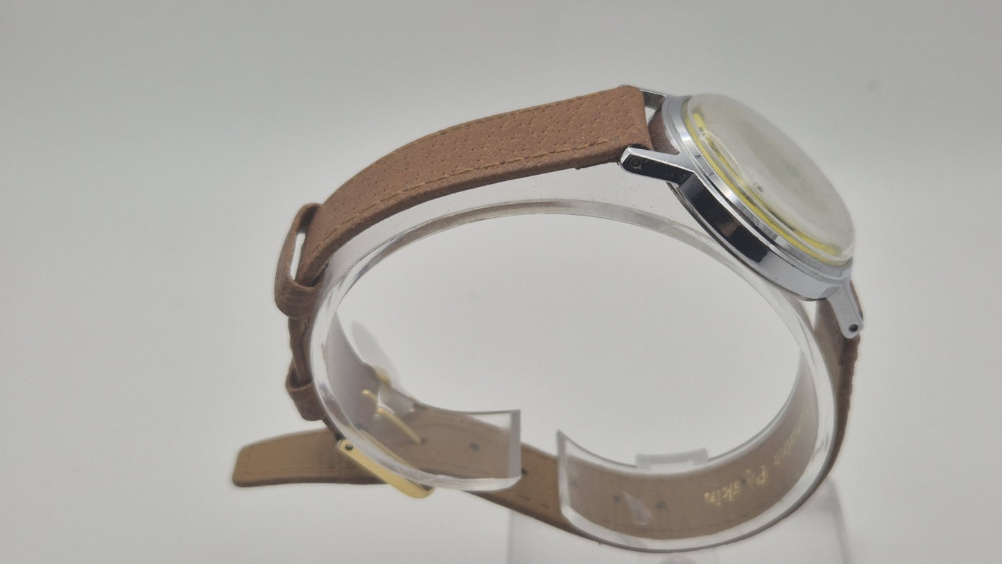 Vintage Timex Snoopy "Tennis" watch features a yellow dial with a mechanical...3