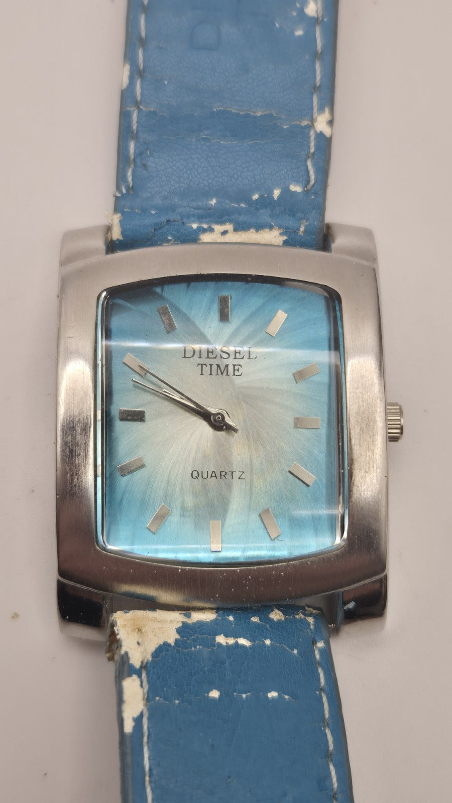 Diesel wristwatch features a rectangular stainless steel case and a blue dial...9