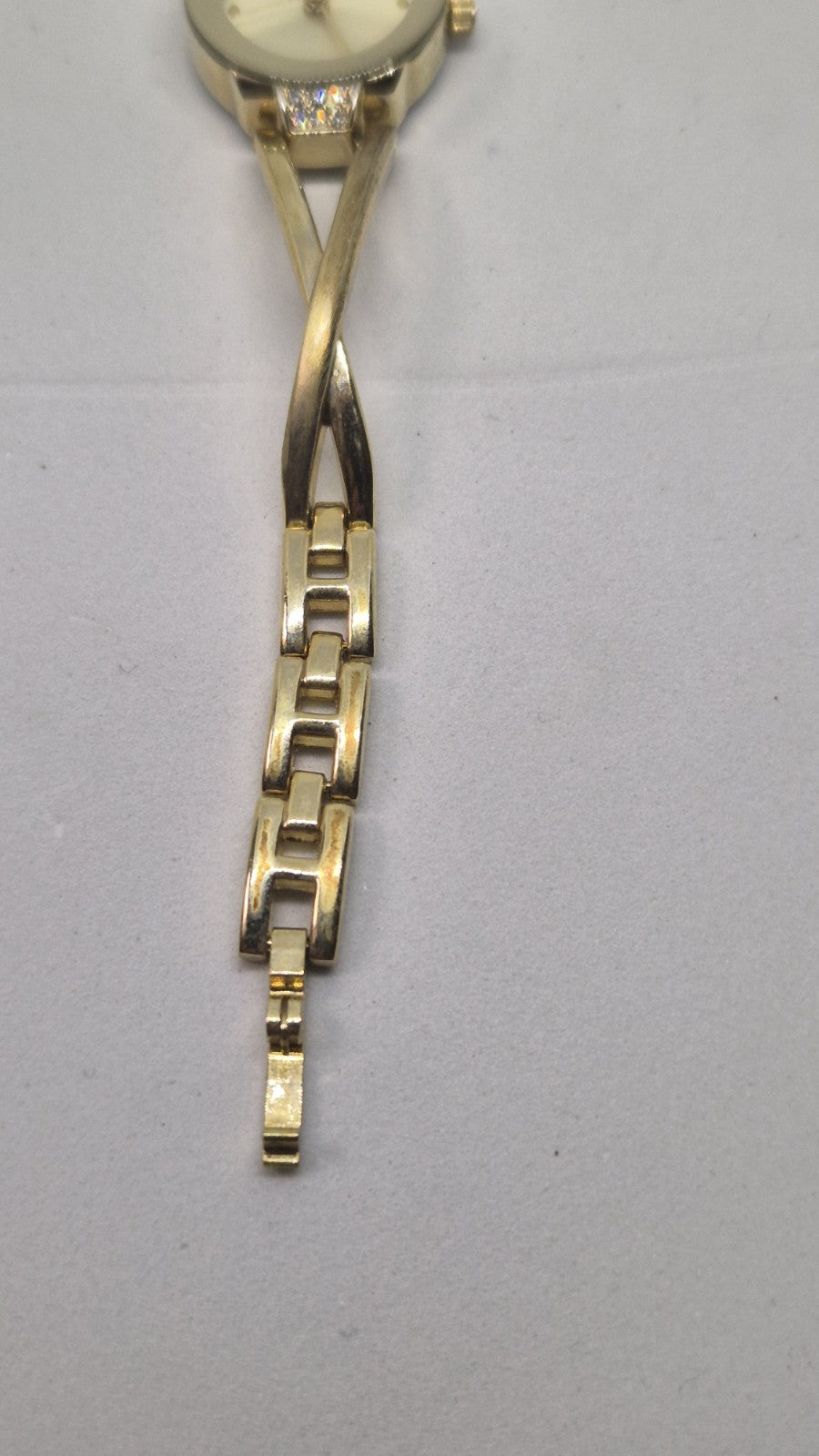 Next women's watch with a goldtone band and a crystalembellished case2