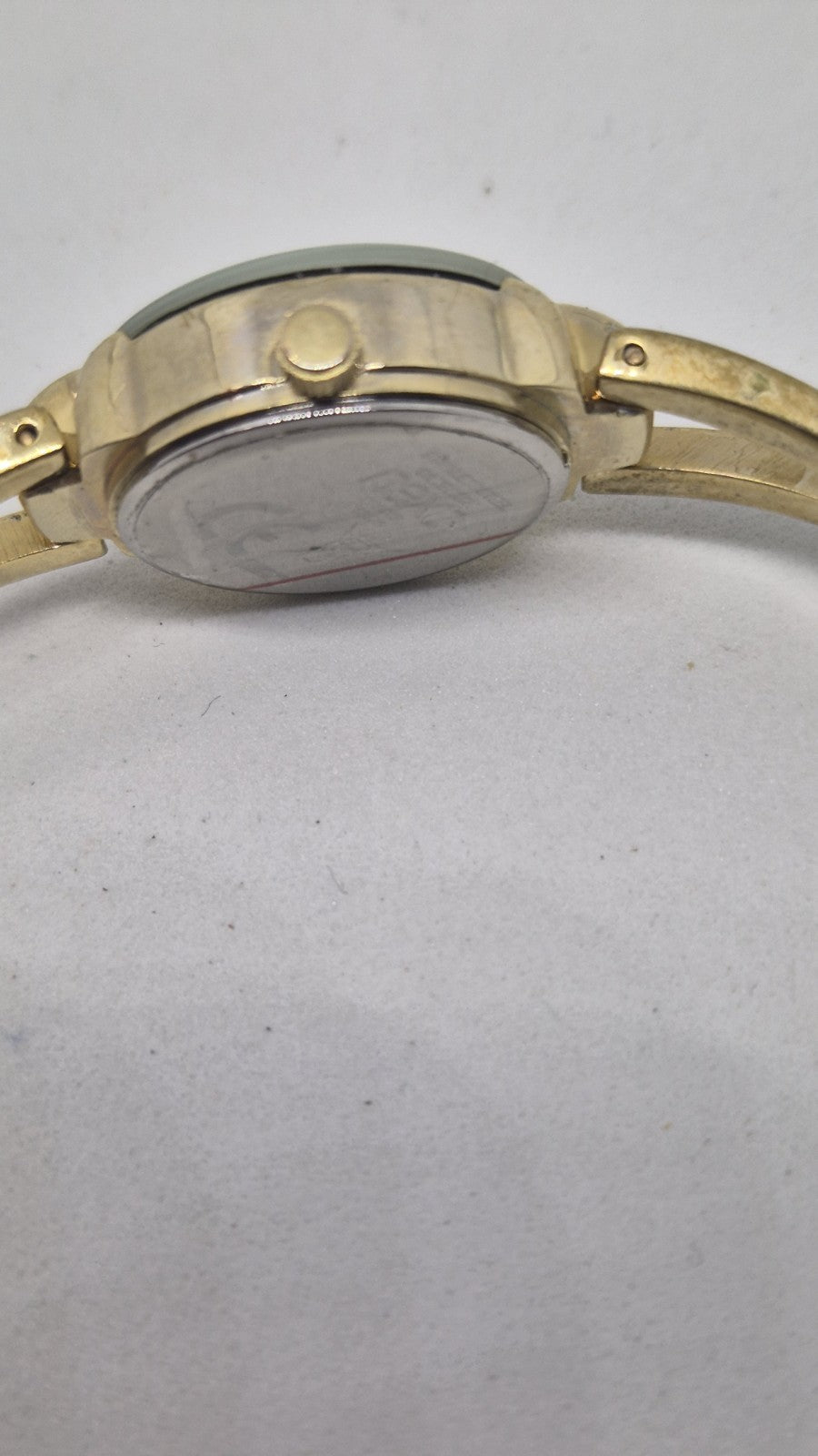 Next women's watch with a goldtone band and a crystalembellished case5