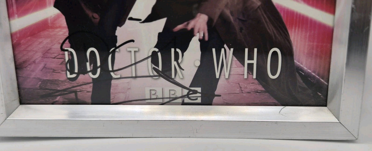 Framed promotional photograph of the Tenth Doctor (played by David Tennant) and3