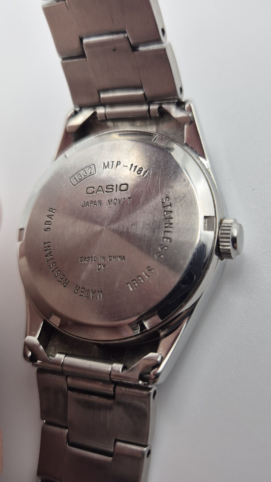 Casio MTP1181 watch with a black dial and stainless steel band9
