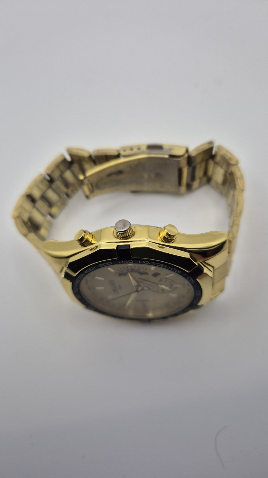 Oruss 1853 men's gold-tone quartz chronograph watch featuring a black tachymetre12