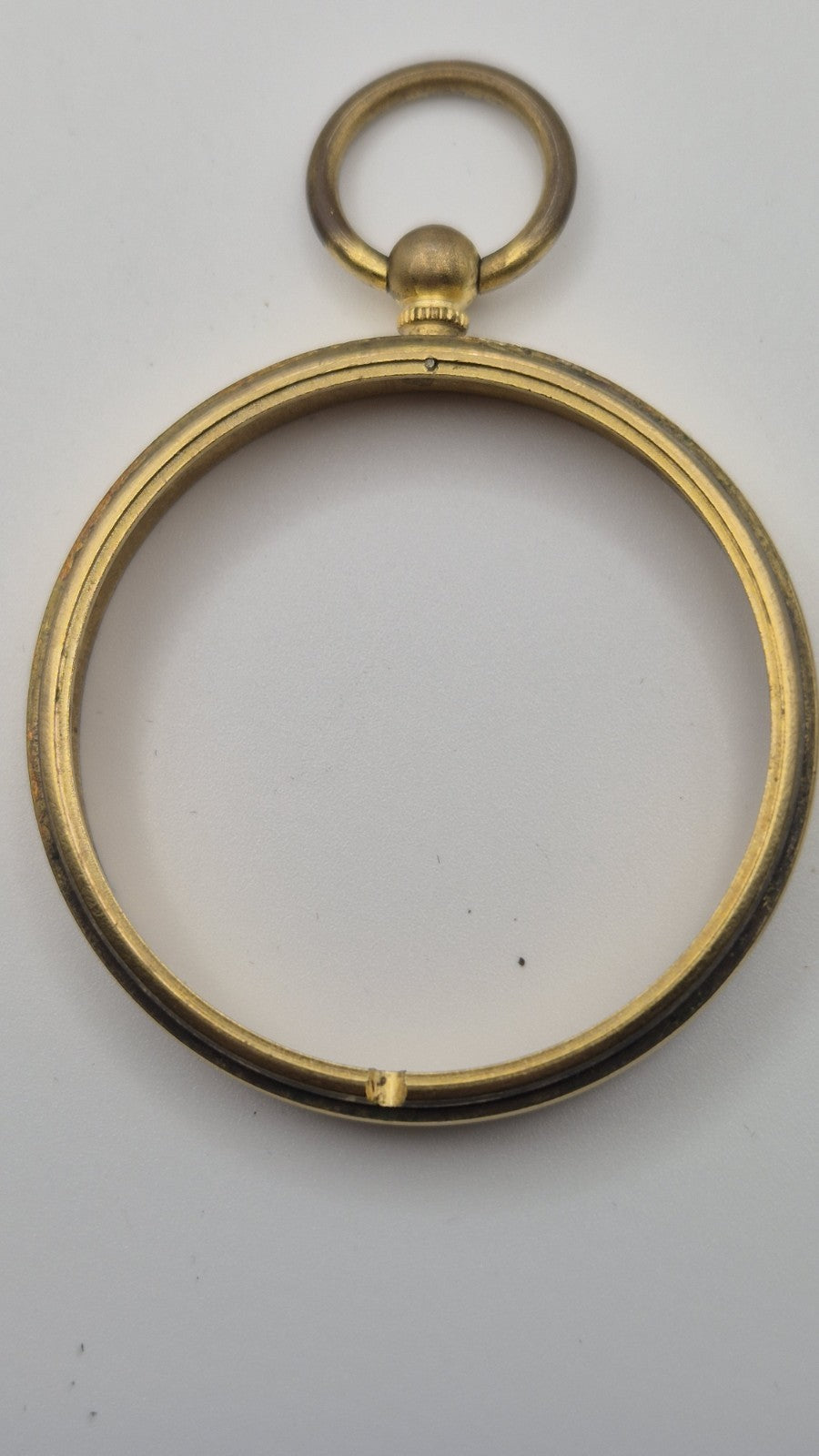 Antique pocket barometer with an altimeter scale in a brass case.8