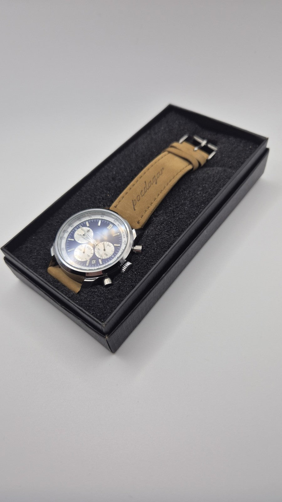 Poedagar men's luxury quartz chronograph watch with a blue dial and a tan...2