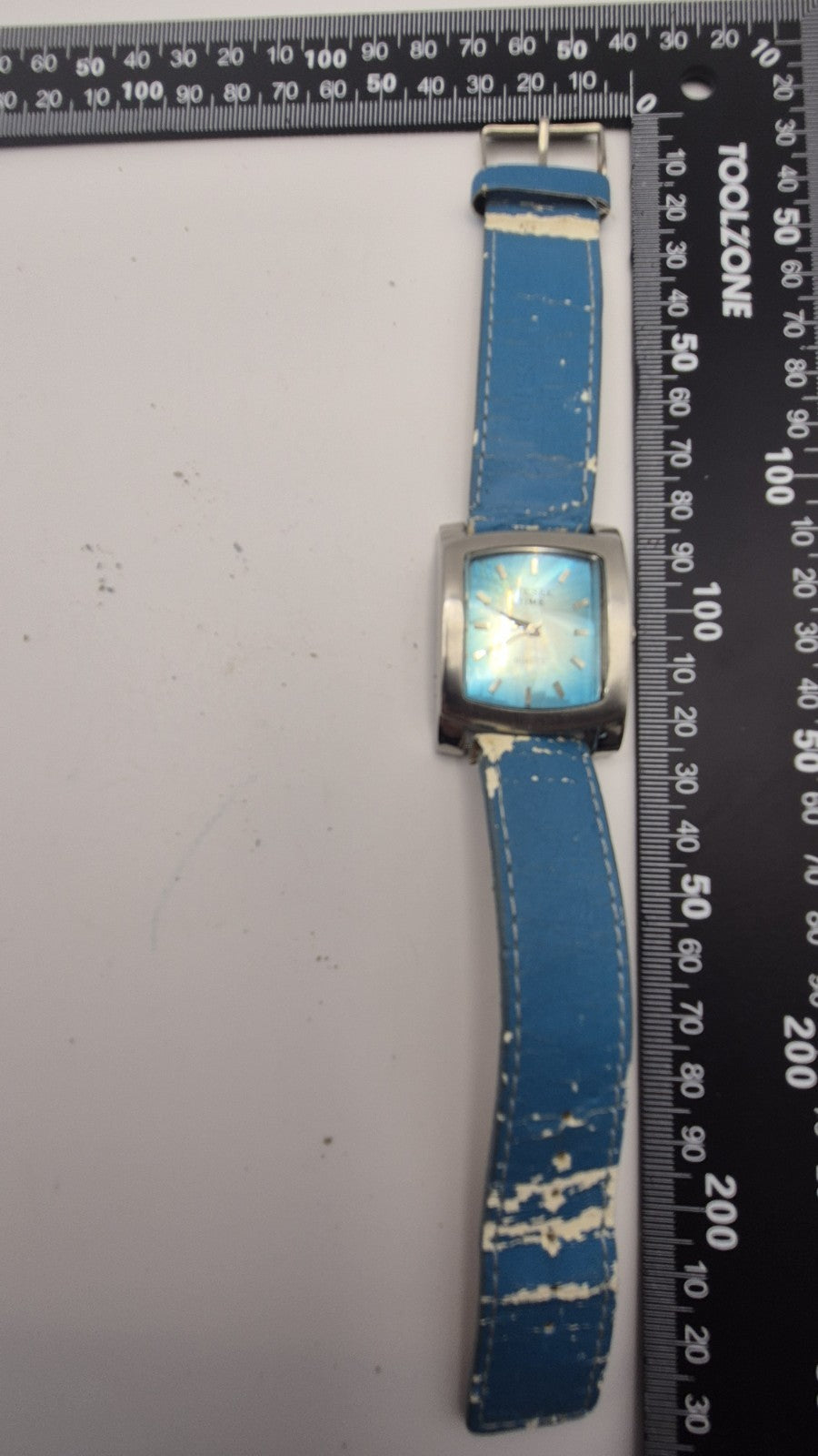 Diesel wristwatch features a rectangular stainless steel case and a blue dial...17
