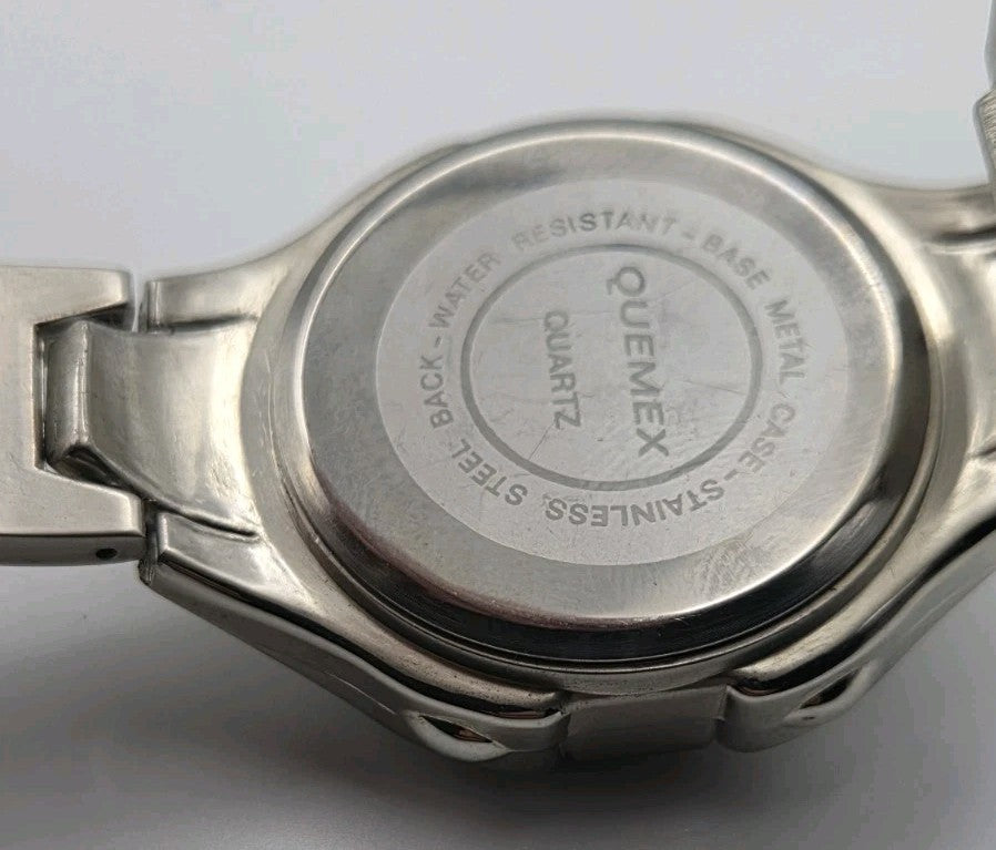 Mens Quemex quartz wristwatch with a silver-tone stainless steel case and...13