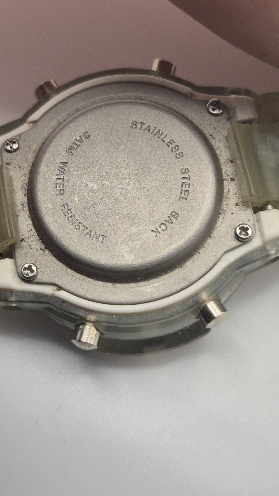 digital watch featuring a blue face and a transparent plastic strap10