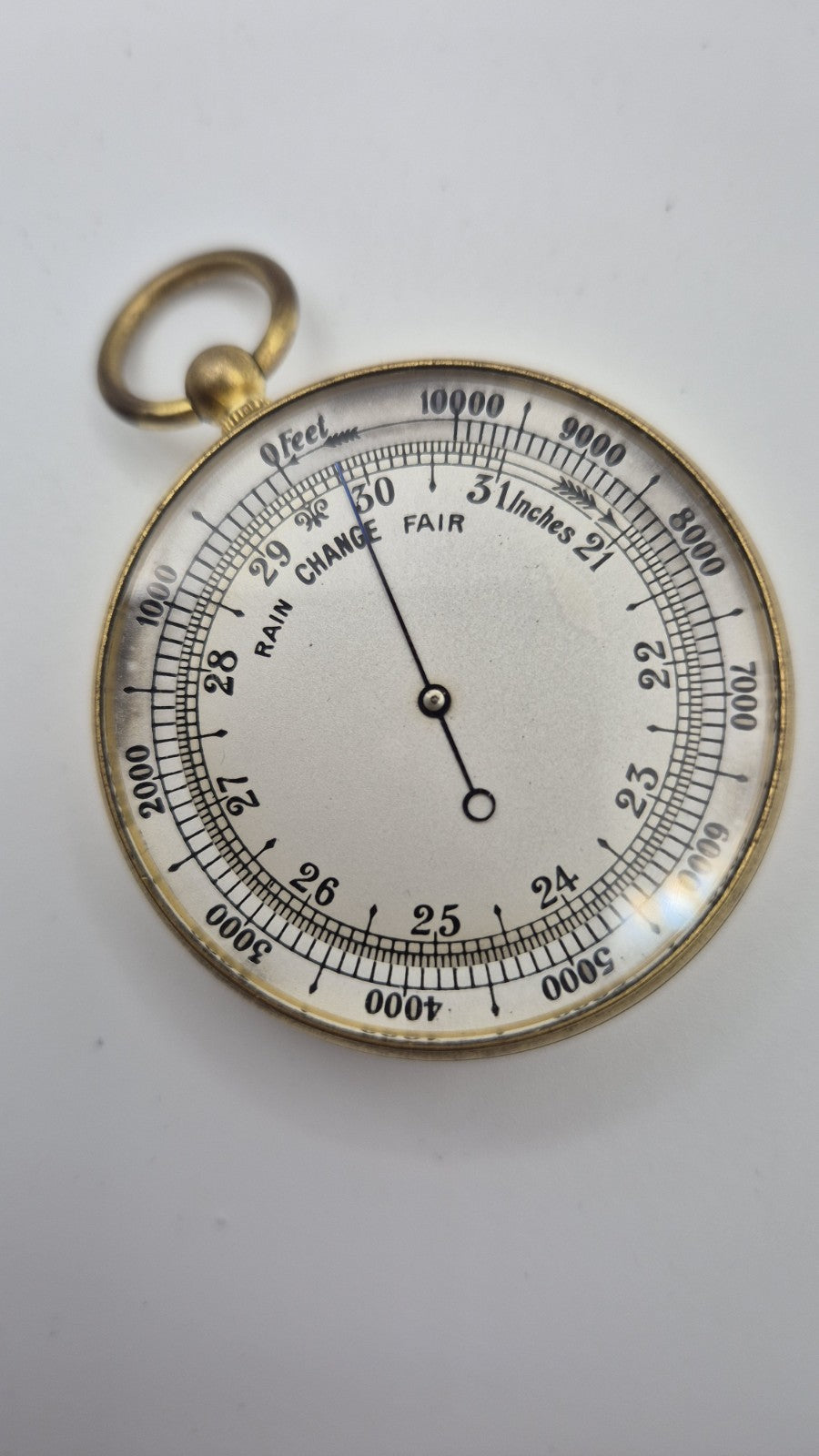 Antique pocket barometer with an altimeter scale in a brass case.2