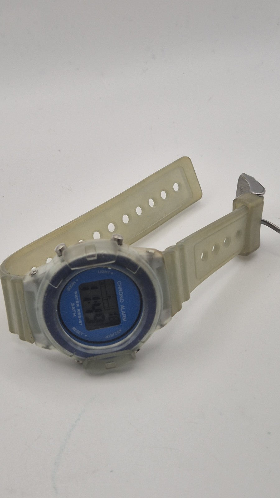 digital watch featuring a blue face and a transparent plastic strap8