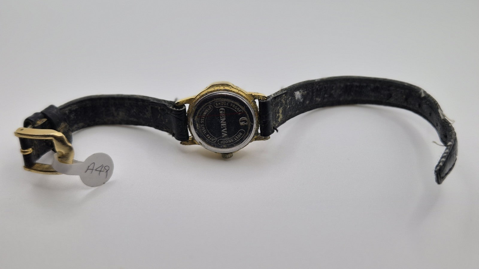 Geneva women's quartz watch with a green dial and goldtone case.5